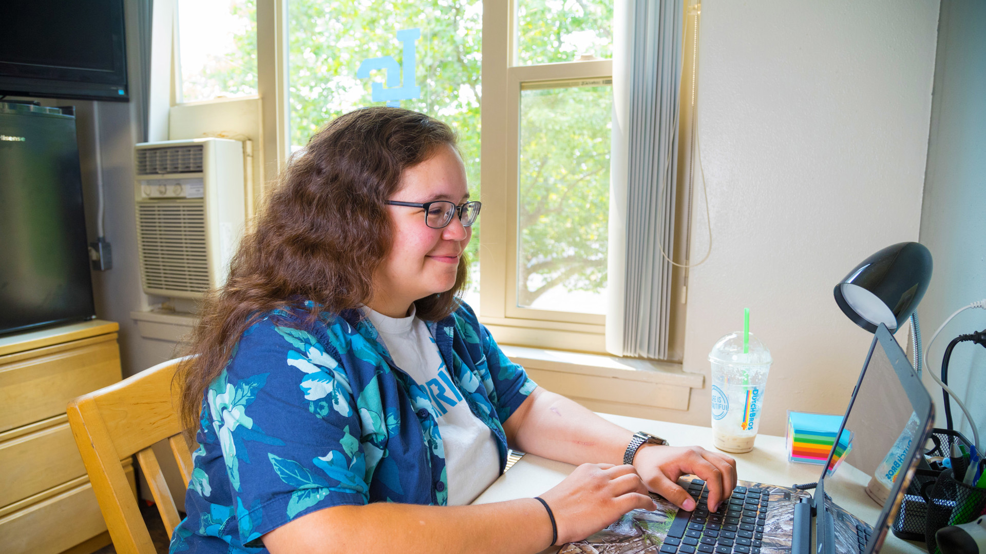 Female students at laptop in dorm